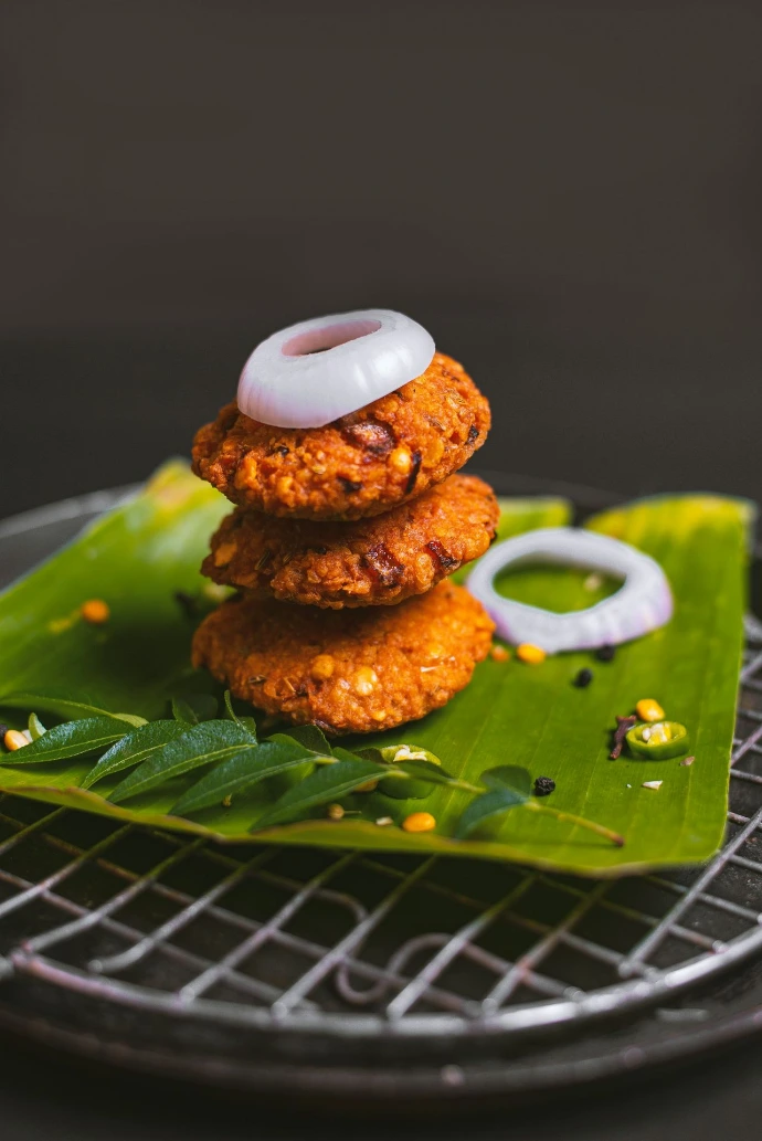 a stack of food sitting on top of a green leaf